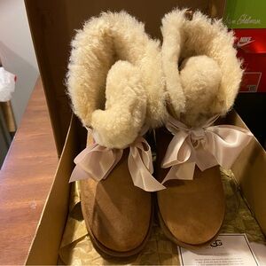Size 8 Ugg boots only worn once mint condition with certificate of authenticity